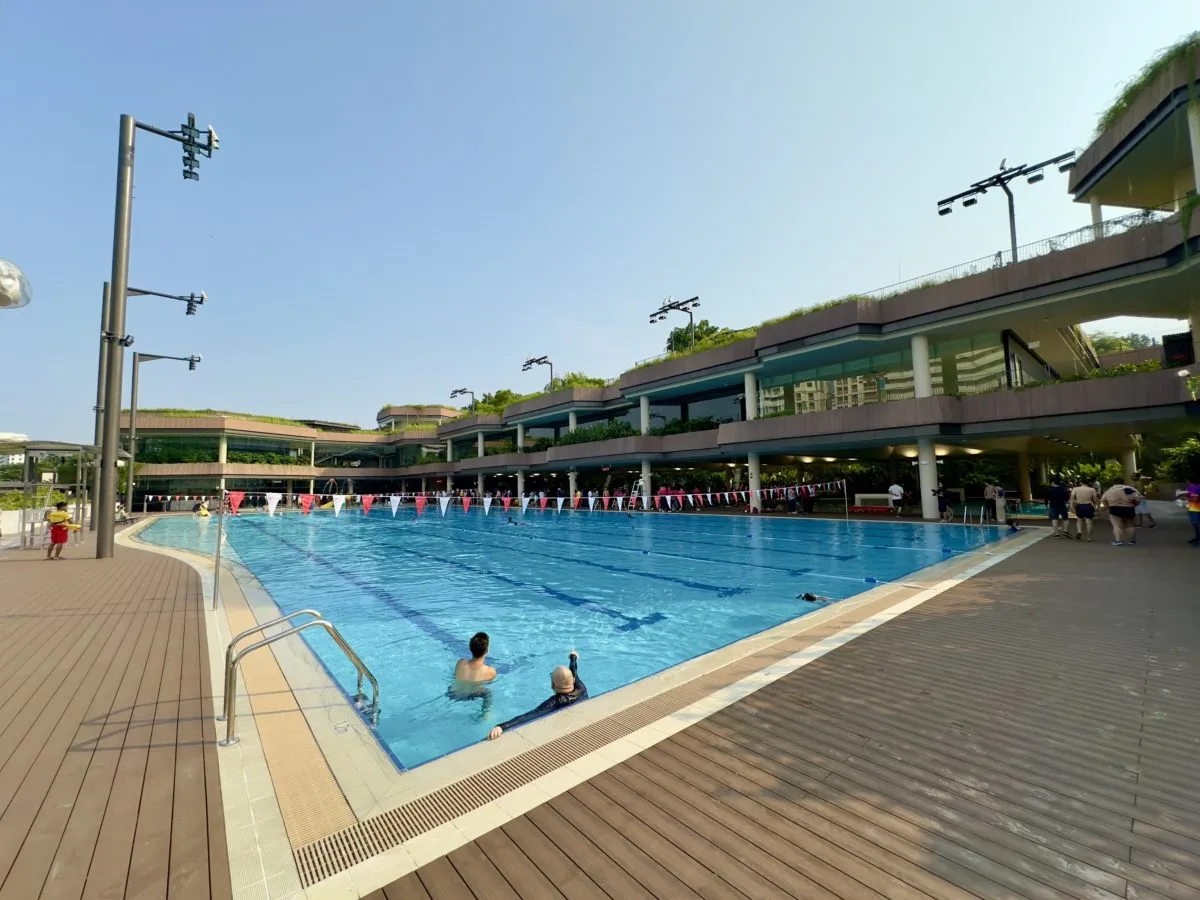 50-metre outdoor competition pool at Bukit Canberra Swimming Complex with modern building